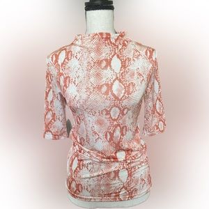 Snake print top with a pop of orange color